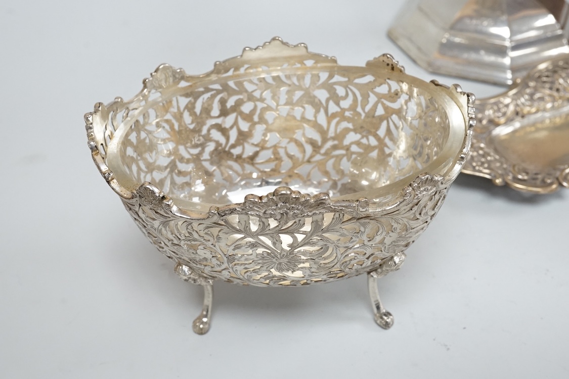 A pair of Edwardian silver mounted octagonal dwarf candlesticks by William Hutton & Sons, London, 1905, 12.7cm, weighted, one lacking sconce, together with a silver pin tray a continental sugar bowl with glass liner and